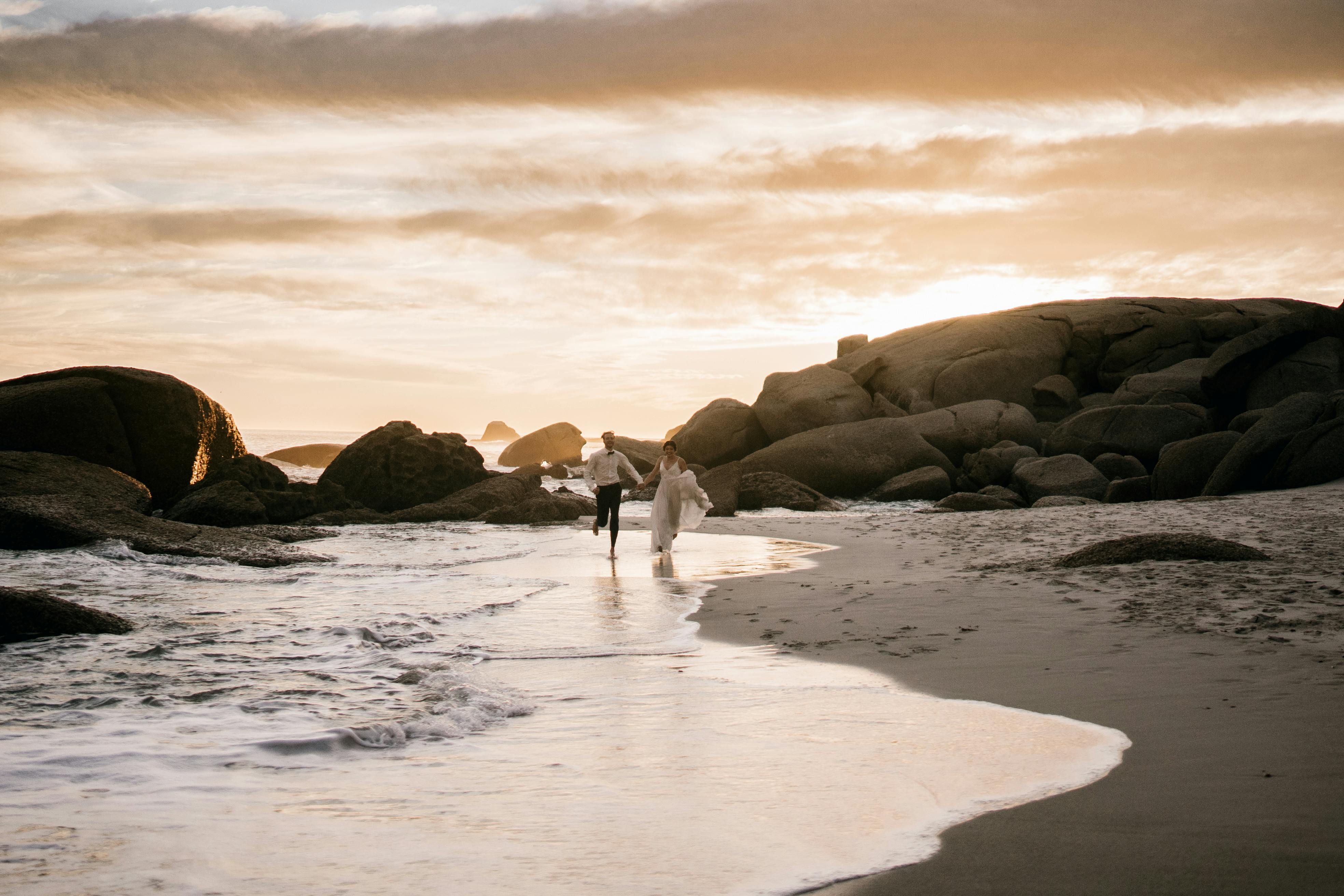Romantic beach wedding couple at sunset
