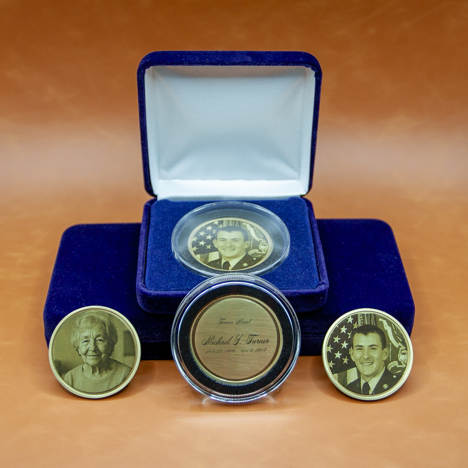 Custom memorial wedding coins displayed in luxury velvet presentation box